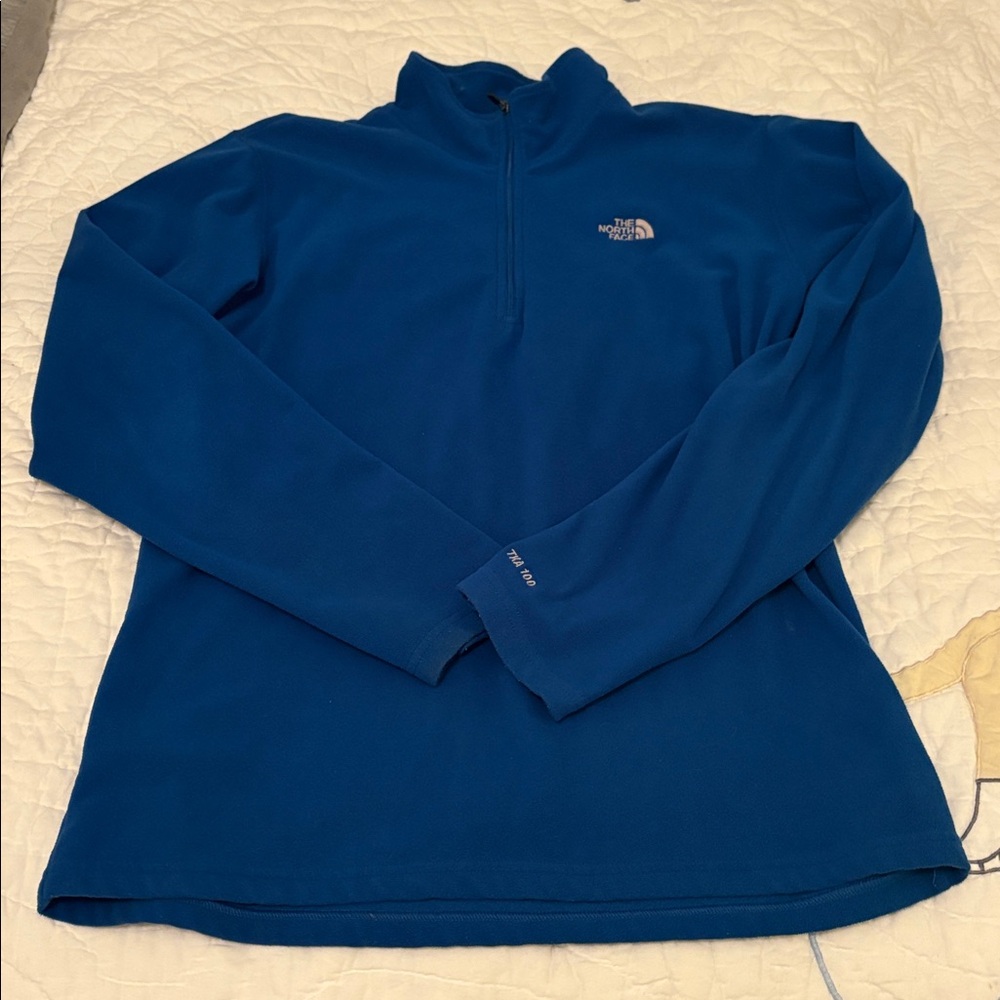 The North Face Women’s Royal Blue Fleece Pullover size XL.  Ice skating/skiing.